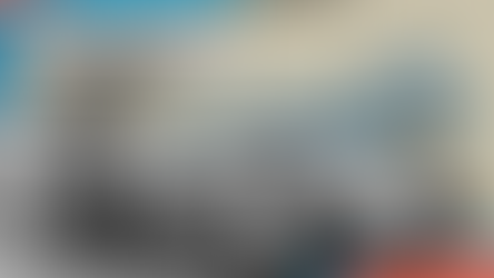 Sir Malcolm Campbell in suit stands by vintage race car, with blue car illustration in background. Text reads: Sir Malcolm Campbell and his Blue Birds.