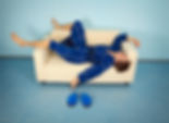 Man sleeping on couch because of snoring