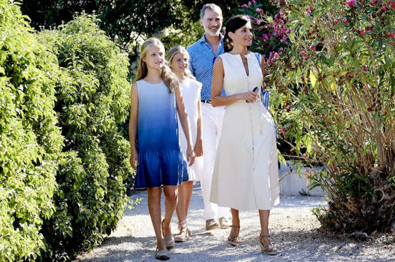 Queen Letizia wearing Uterqüe dress during public appearance with family.