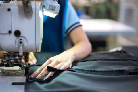Person using a sewing machine