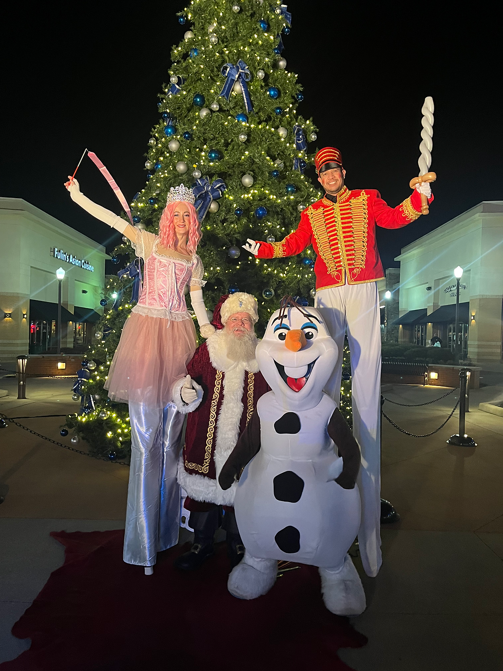 Living statue dressed as holiday ice princess greeting guests at Nashville corporate event