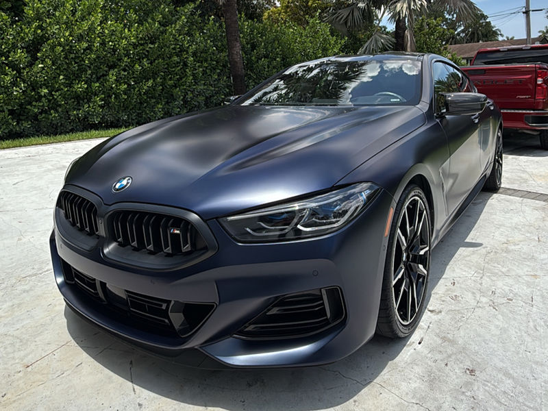 Matte BMW 8 Series after detailing in a South Florida driveway