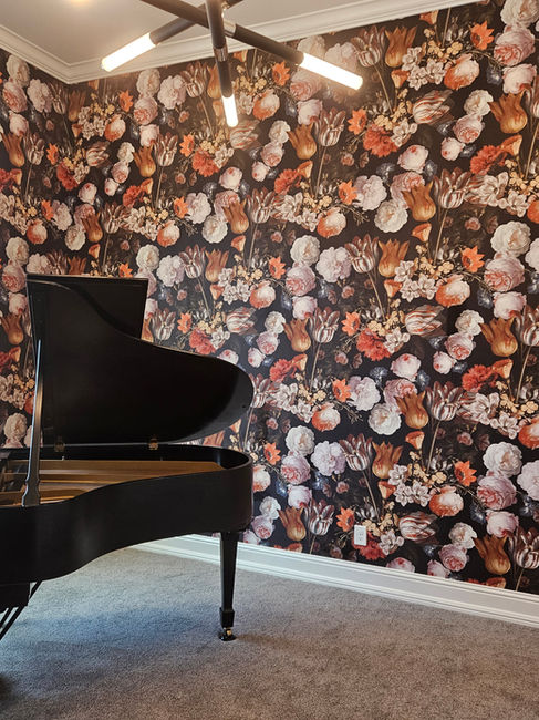 Wallpapered room with the piano