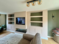 Closer view of the three-sided electric fire and stepped-out chimney breast detail in the finished Hassocks media wall
