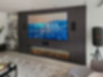 Cine Spark Media Wall with surround sound set up and electric fire, hidden cupboards and bespoke paneling