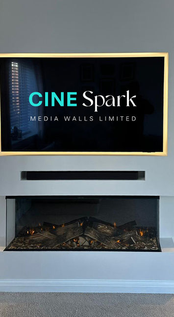 Cine Spark Media Wall with stepped out centre section, 3 sided electric fire and built in storage