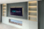Cine Spark Media Wall with inset fire, bespoke cabinetry and Philips Hue strip lighting