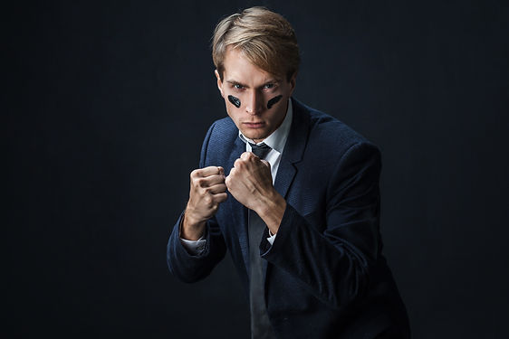 Businessman with war paint on his face.