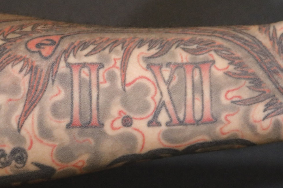 Behind left forearm