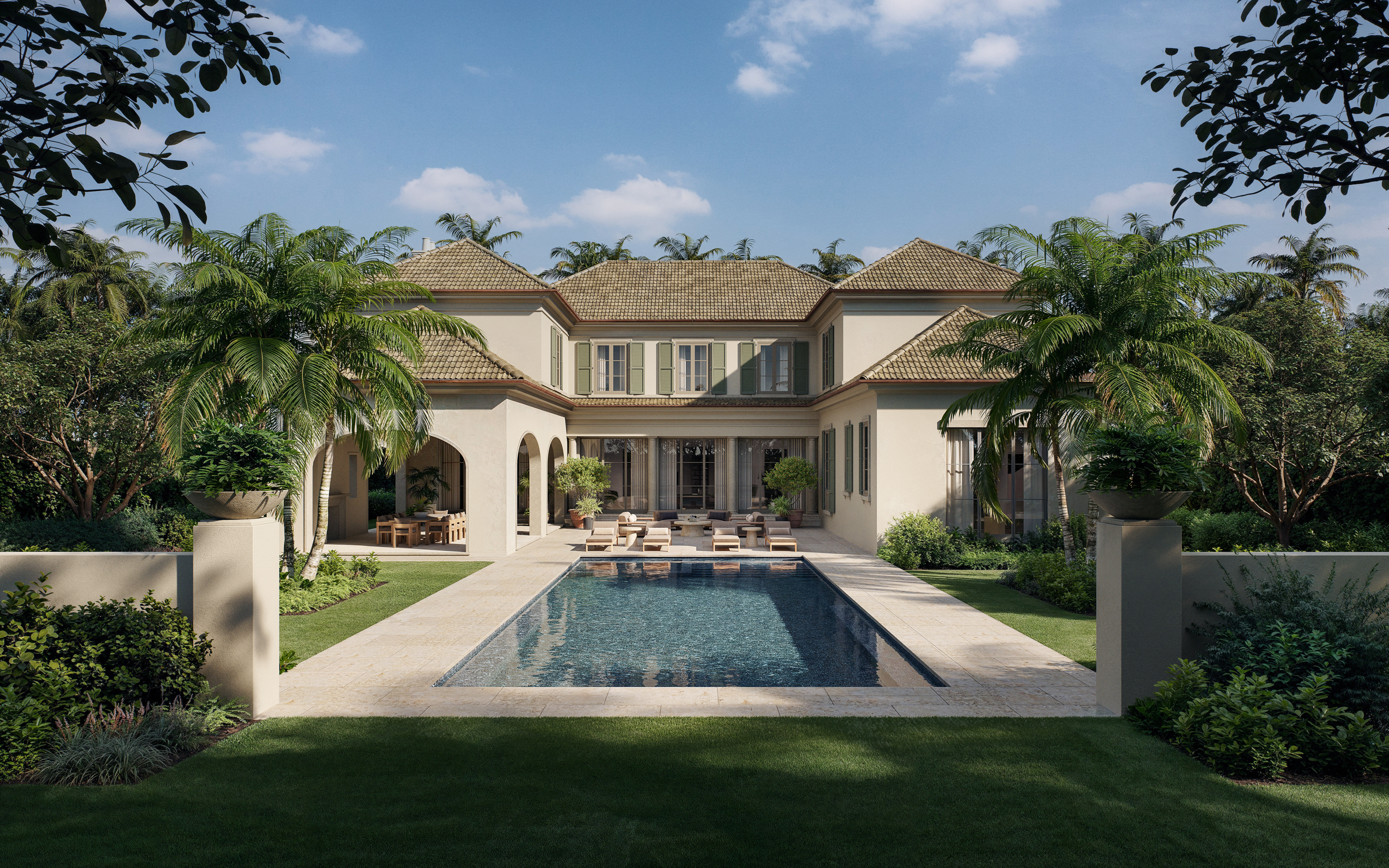 A two-story beige house with a tiled roof, palm trees, and a rectangular swimming pool in the backyard
