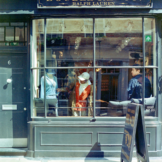 A person shopping in a Ralph Lauren store in Soho on Portra 400NC.