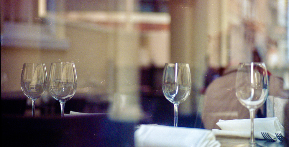 Still life of glasses in a closed restaurant before service starts.