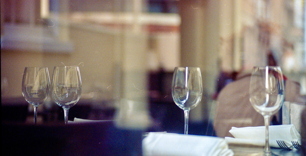 Still life of glasses in a closed restaurant before service starts.