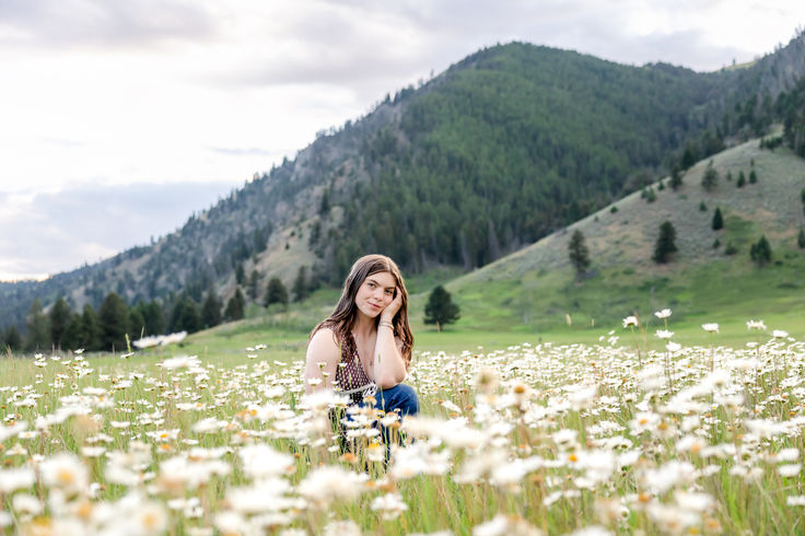 big sky high school senior portrait photos among wildflowers