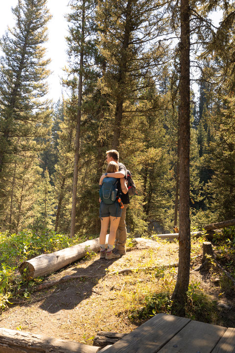 Just engaged couple at Ousel Falls in Big Sky Montana