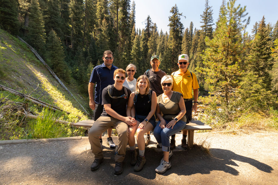 Family photo after surprise proposal at Ousel Falls in Big Sky Montana