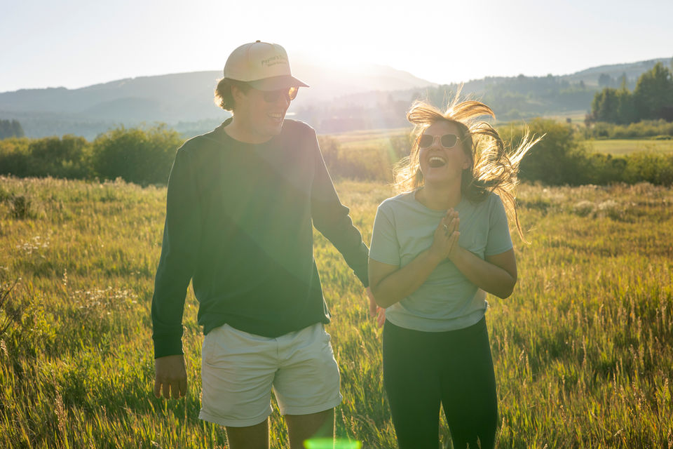 Newly engaged couple at sunset Big Sky Montana