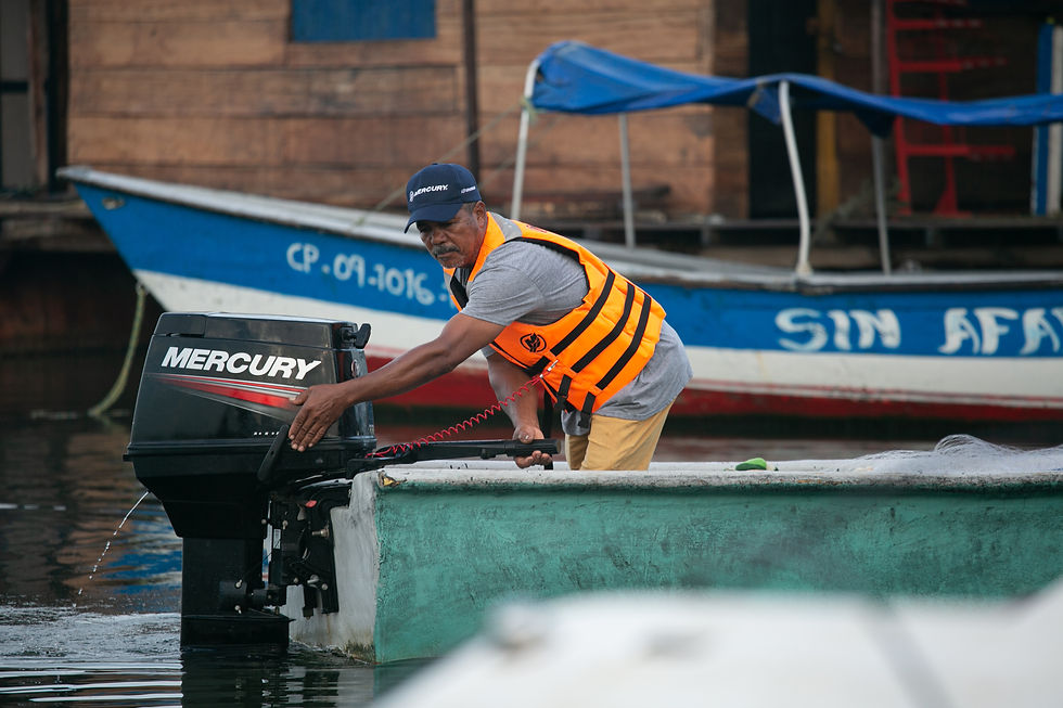 Boatsman in boat with Mercury Outboard