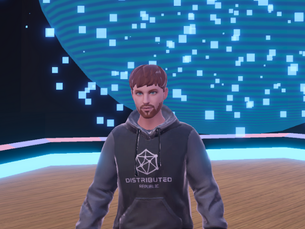 A man in a gray hoodie with "DISTRIBUTED REPUBLIC" stands on a wooden floor with blue digital patterns floating behind him.