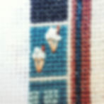 ice creams using french knot and straight stitch on a background of cross stitch