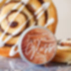 cinnamon bun cross stitch by sew luxe co in front of cinnamon bun