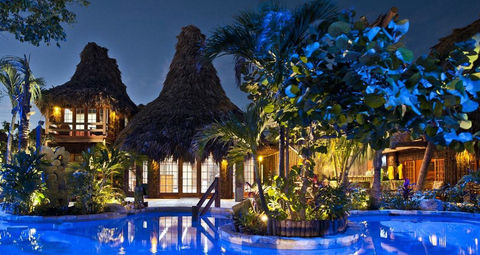 hotel in Belize swimming pool at night