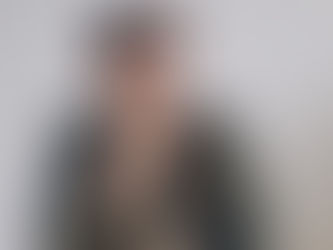Man covering his mouth and thinking