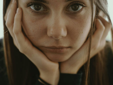 woman with chin in hands