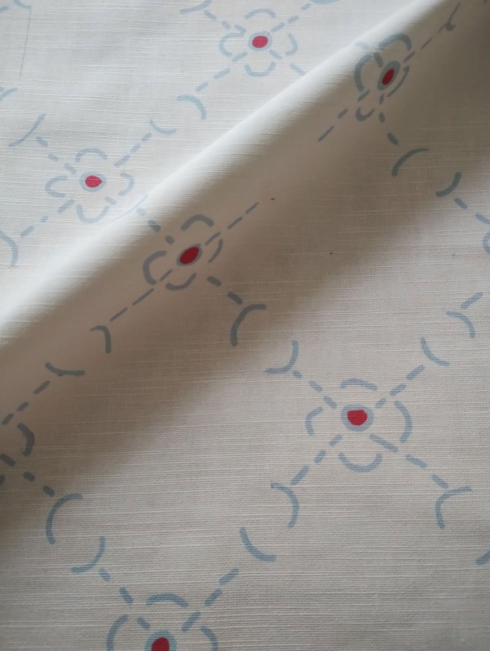 Lana fabric patten with soft pink colour and blue pattern