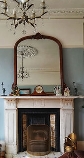 Stunning fireplace with a large mirror.