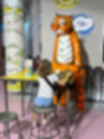 Visitors often stop to share tea and cake with the Tiger in our The Tiger Who Came to Tea exhibit.