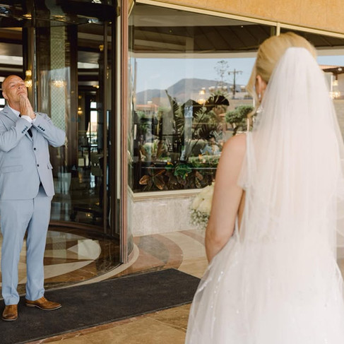 real elizabeth kate bride showing her dad her Enzoani Love Caroline wedding dress at a first look