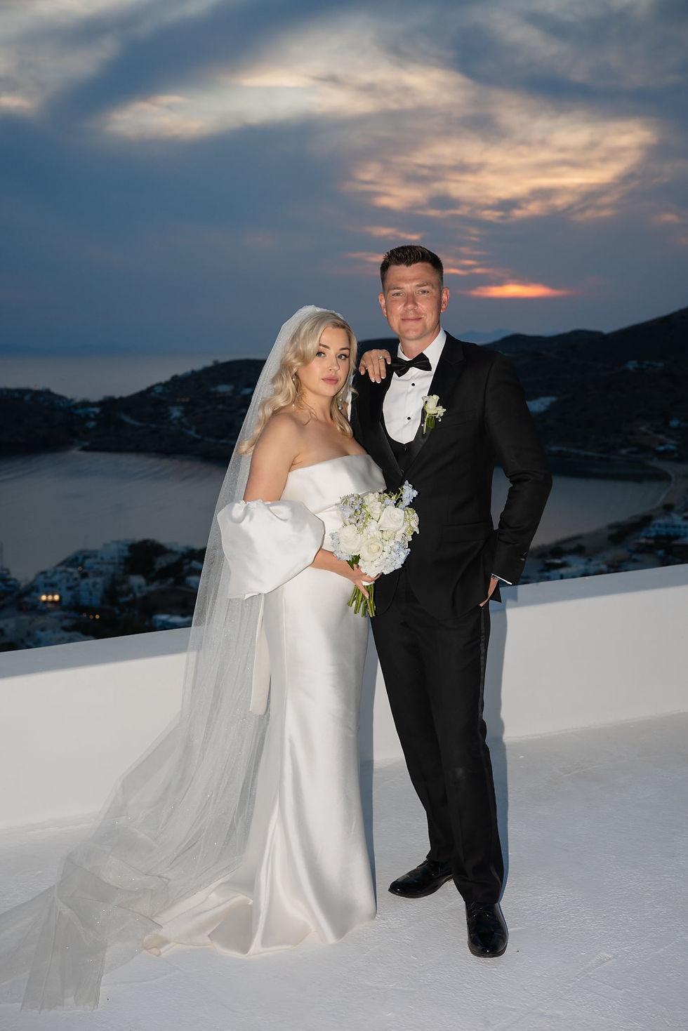 Elizabeth Kate Bride at a destination wedding Wearing Eva lendel Alegra wedding dress with detachable overskirt, detachable puff sleeves and veil