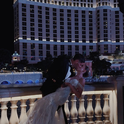 Real bride Chloe wearing her nude bridal gown with double-layer train from Elizabeth Kate Bridal, South Yorkshire, at Chapel of the Flowers, Las Vegas