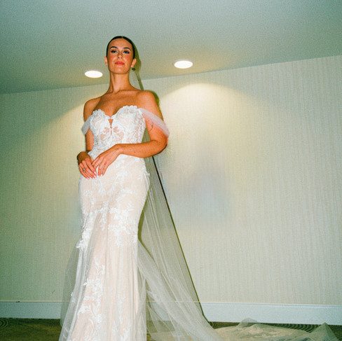 Real bride Chloe wearing her nude bridal gown with double-layer train from Elizabeth Kate Bridal, South Yorkshire, at Chapel of the Flowers, Las Vegas