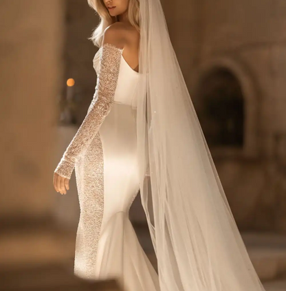 Bride wearing Eva lendel Envy, Plain Satin wedding dress with long lace sleeves at Elizabeth Kate Bridal Crowle