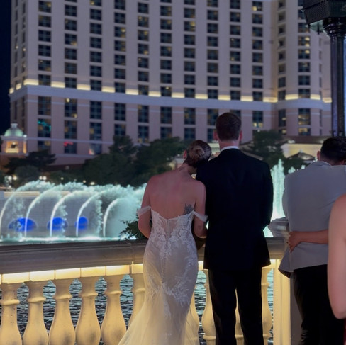 Real bride Chloe wearing her nude bridal gown with double-layer train from Elizabeth Kate Bridal, South Yorkshire, at Chapel of the Flowers, Las Vegas