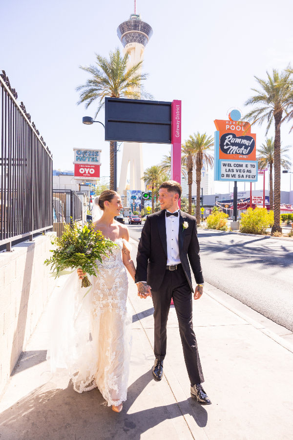 Real bride Chloe wearing her nude bridal gown with double-layer train from Elizabeth Kate Bridal, South Yorkshire, at Chapel of the Flowers, Las Vegas