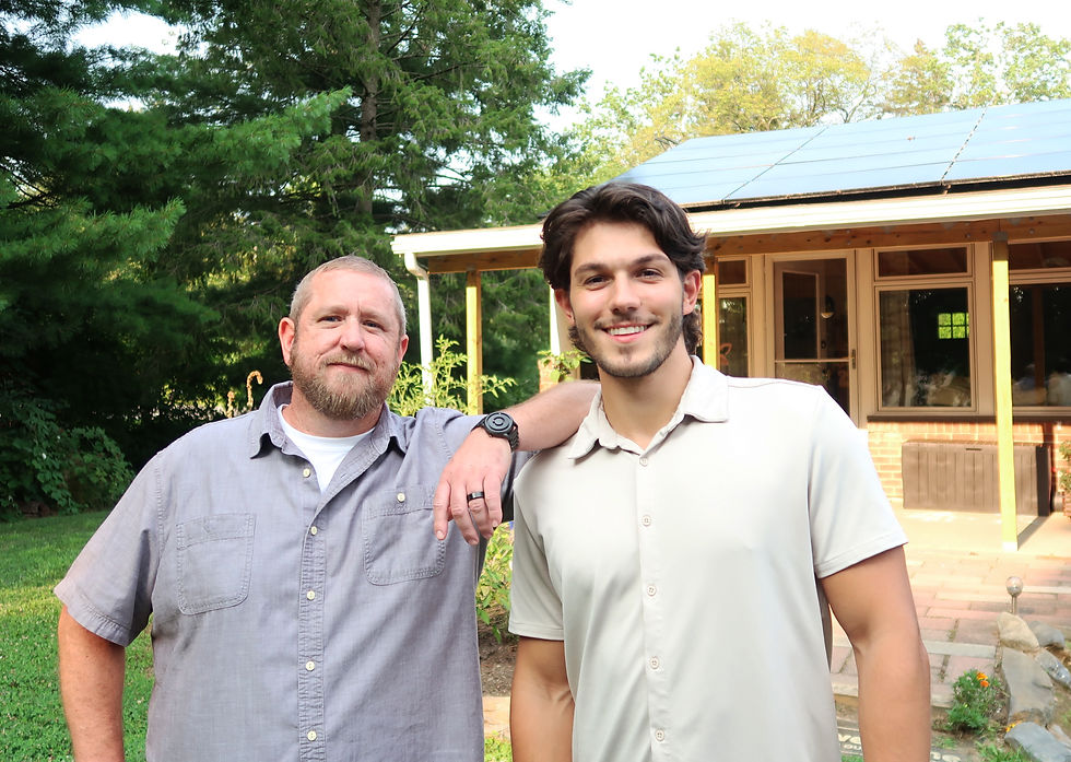 Craig Hightower and Drew Zarrella of New Energy Project Management in front of Craig's home