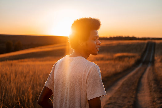 person-enjoying-warm-nostalgic-sunset.jpg