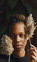 african-girl-room-stylish-girl-with-plant-lady-black-sweater.jpg