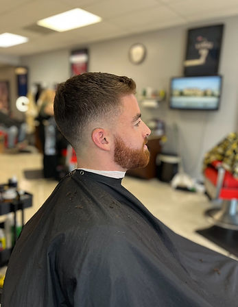 High cut fade and bead trim from side view