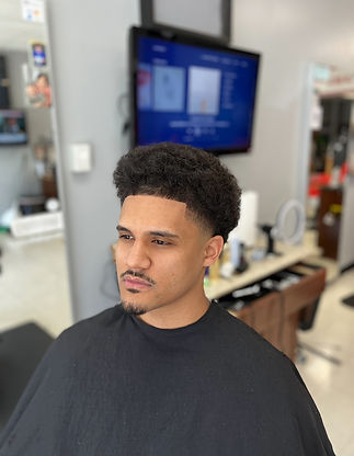 Trimmed hair and boxish front hair line 