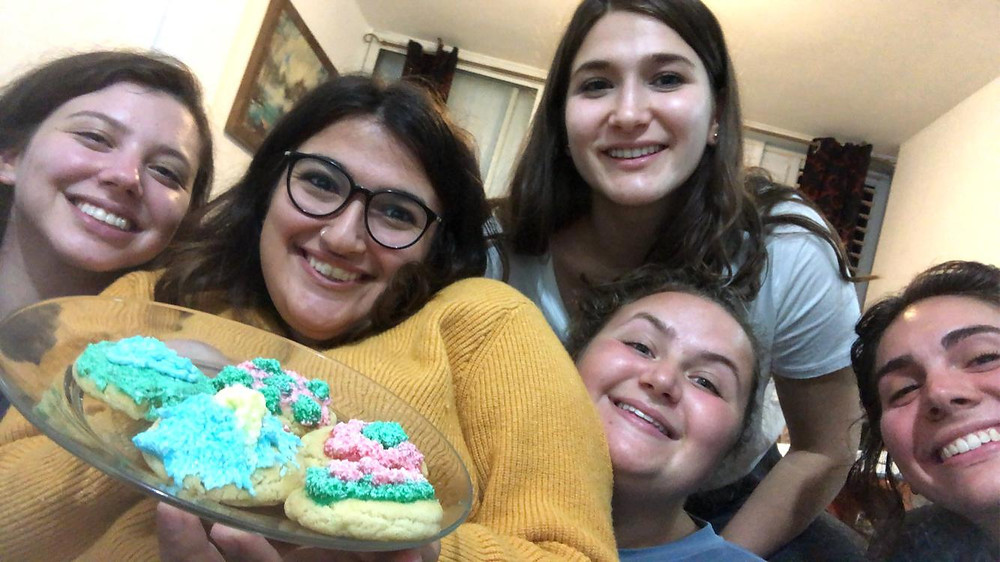 The author, far left, and her roommates with their Hanukkah cookies.
