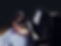 Cute little princess girl plays piano in the dark room.jpg