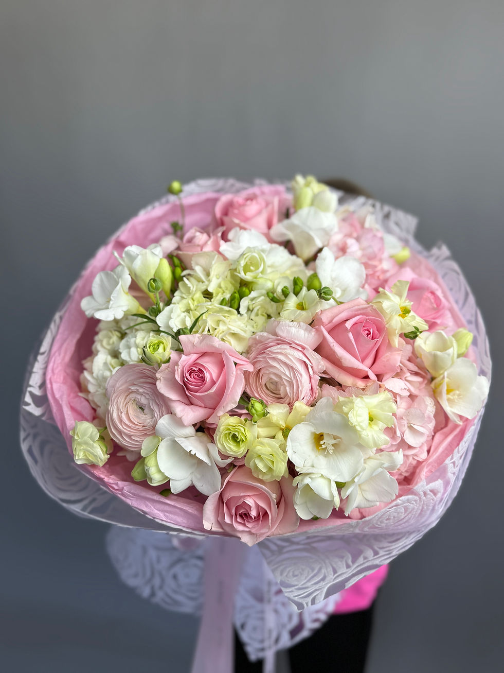 delicate bouquet in pink packaging