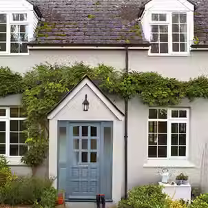 Exterior house painting in the UK: comparing DIY vs professional services for cost, quality, and safety.