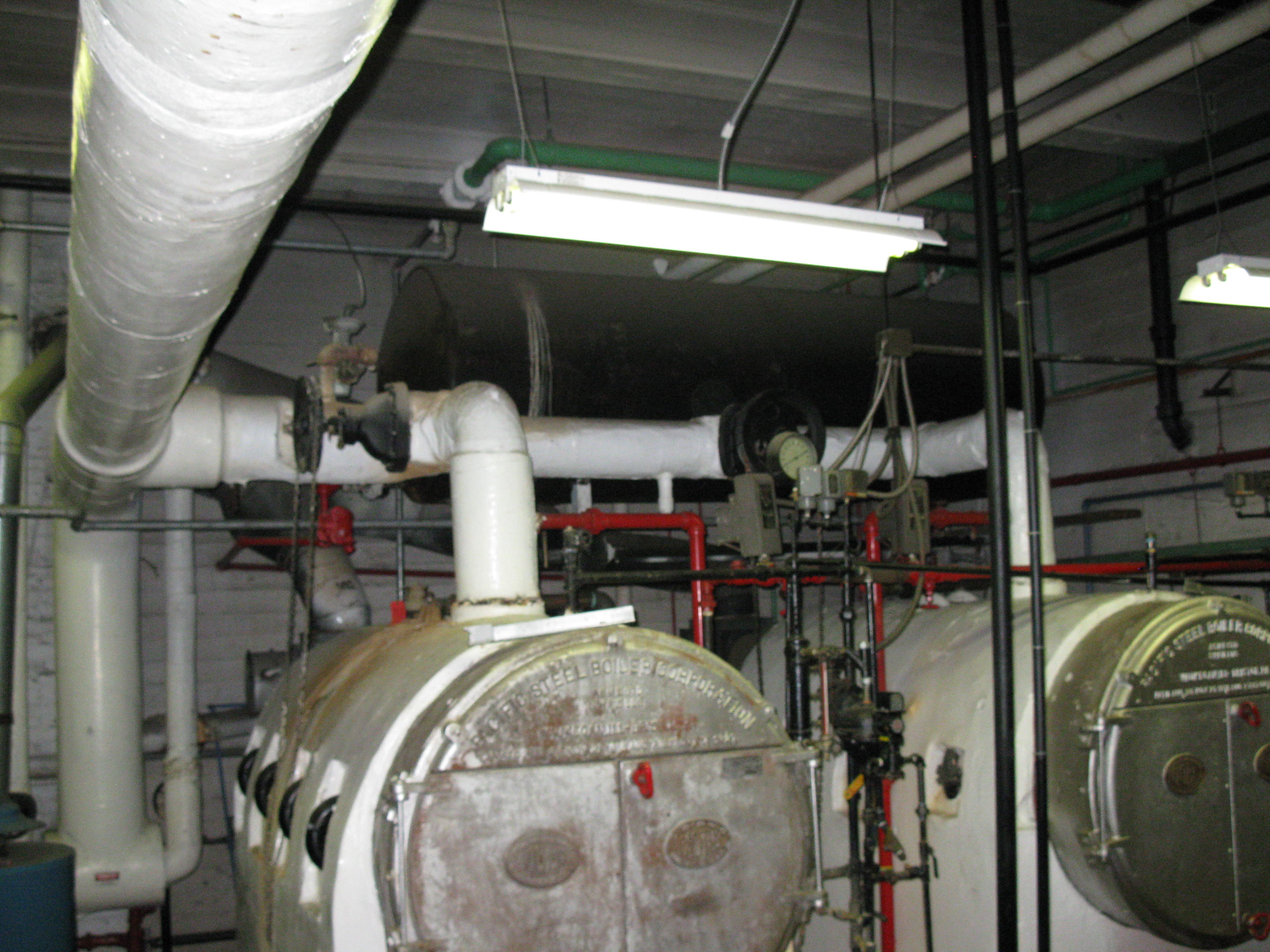 Retrofit: Replace existing fire tube steam boilers with new gas fired, sectional steam boilers.