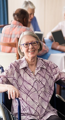 portrait-of-smiling-disabled-senior-woman-sitting-2025-04-05-03-47-56-utc.jpg