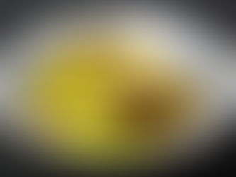 Stir-fried mushrooms and celery on a blue ceramic plate set against a dark background. Earthy tones of brown and green dominate the dish.